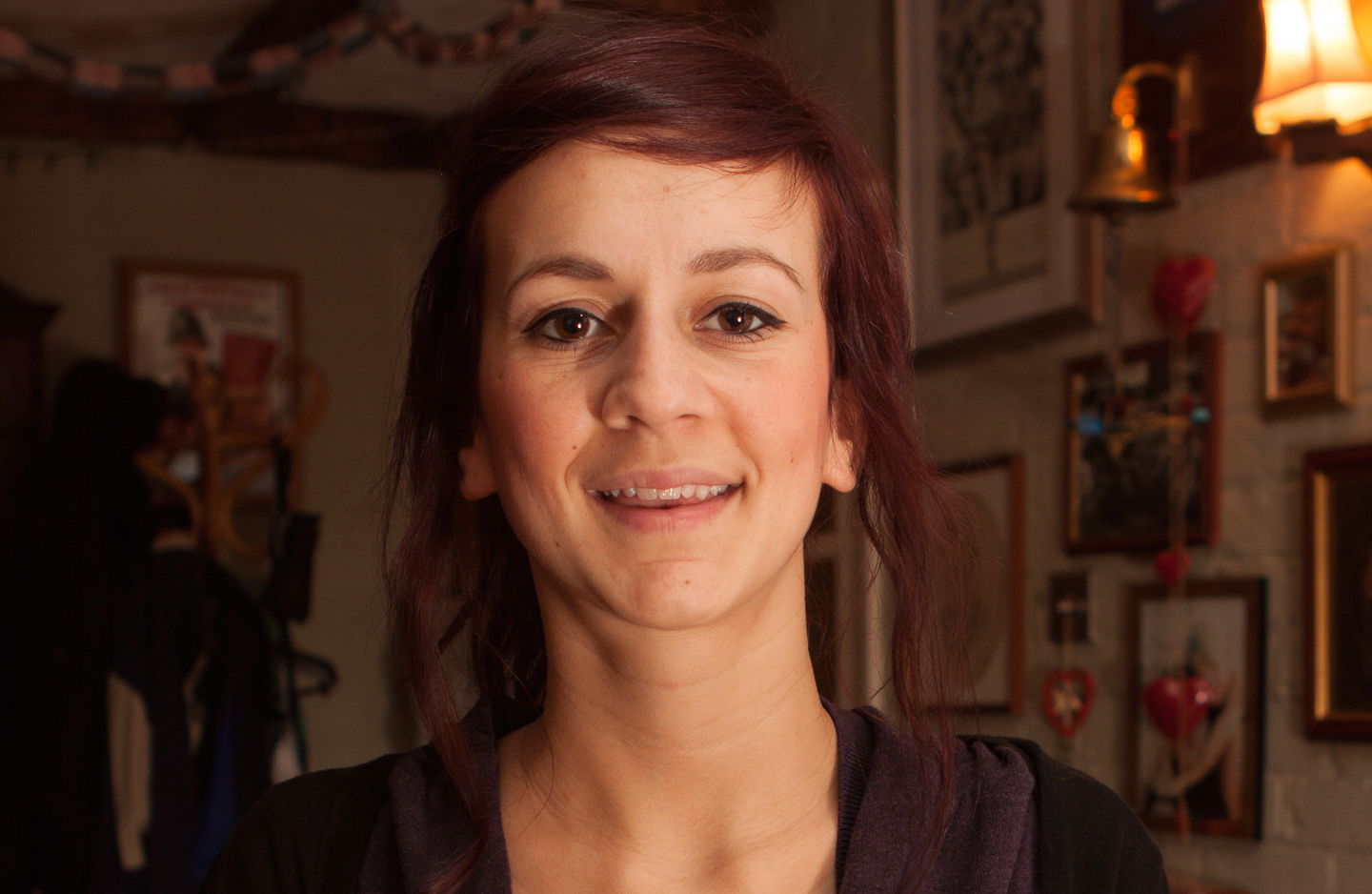 A headshot of a woman using indoor flash portrait lighting