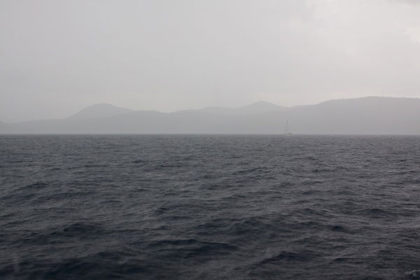 Sea and mountains in the horizon covered in mist