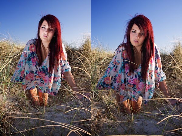 A fill-in flash illuminates a girls face as she sits in the sand