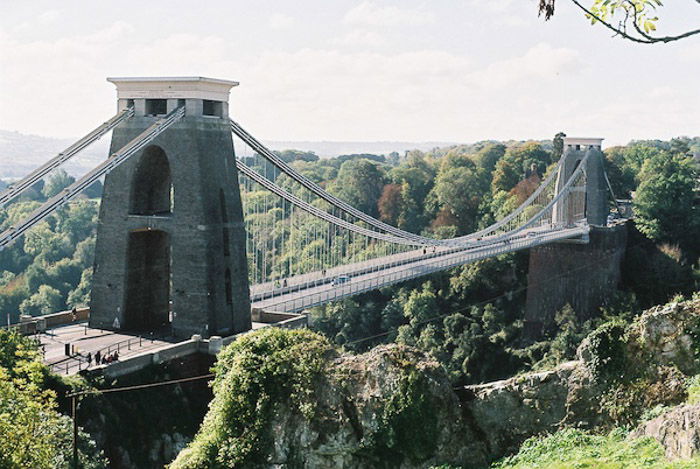 An old stone bridge amidst a green landscape - how to take better photos 