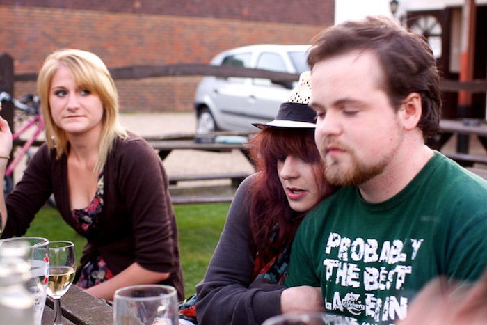 A candid portrait of friends sitting outdoors - dynamic tension photography 