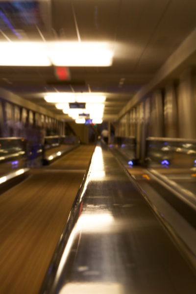 An indoor conveyor belt moving in a continuous loop. 