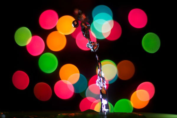 A shot of a water drop with an interesting bokeh background