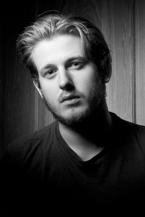 Black and white headshot photography of a young male model