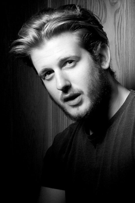 Black and white headshot photography of a young male model