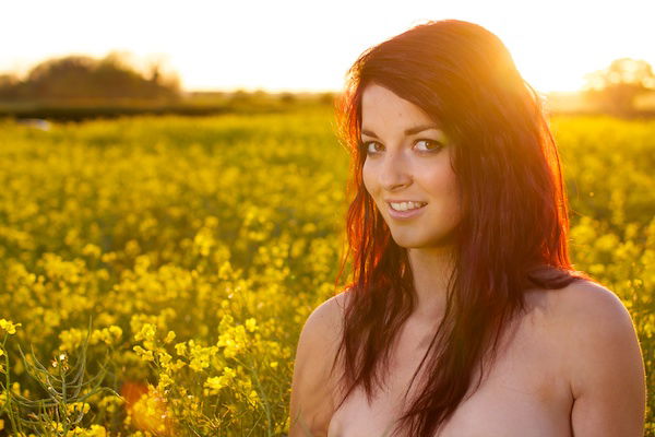 Edited photo of a young woman in the field of yellow flowers