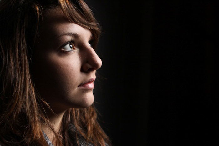 Atmospheric low key portrait of a female model