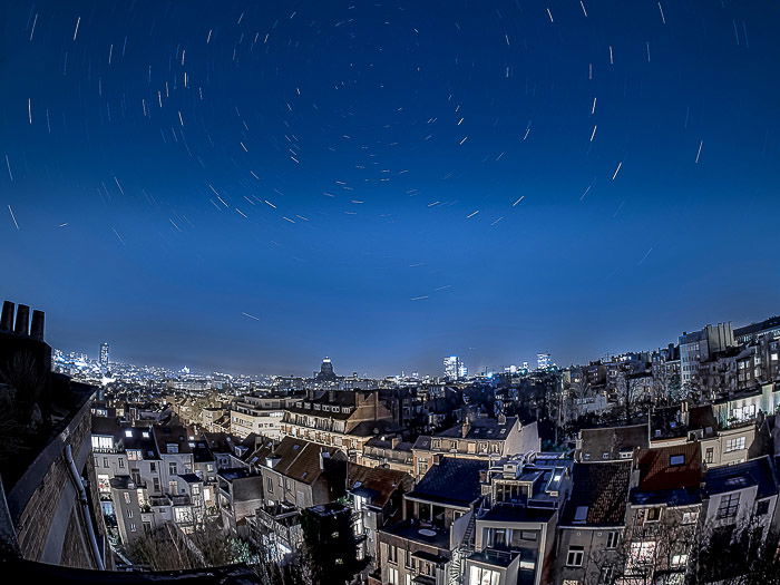 A stunning shot of the night sky over a cityscape