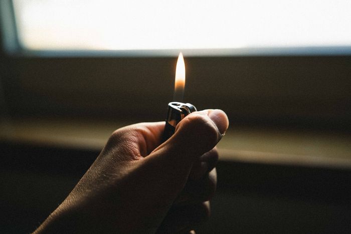 hands holding a lighter