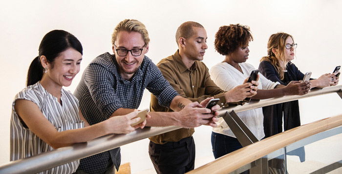 A candid photography shot of a group chatting at a corporate event 