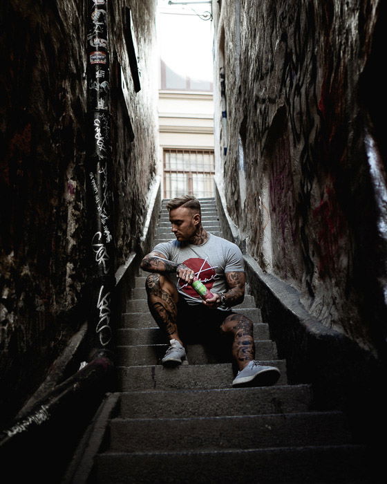 A candid portrait of a man sitting on steps