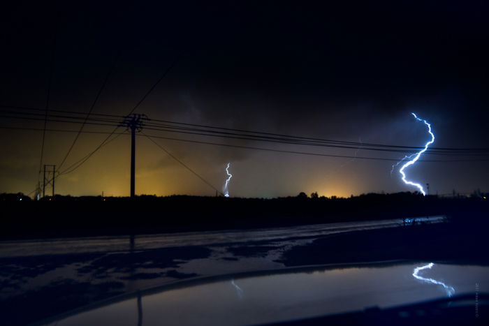 Dramatic Weather: Lightning strikes on the horizon during a thunderstorm