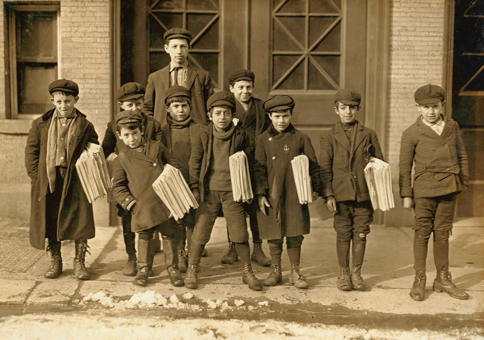  Early 20th century sepia photo of newsboys in Connecticut