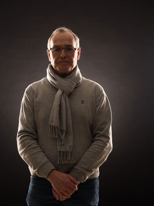 Portrait of older man lit with hero lighting