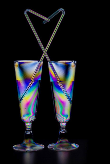 Rainbow heart effect from two plastic glasses and drinking straws