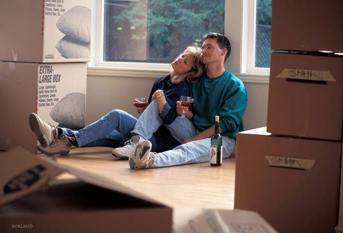 a couple moving to a new house and having rest with vine