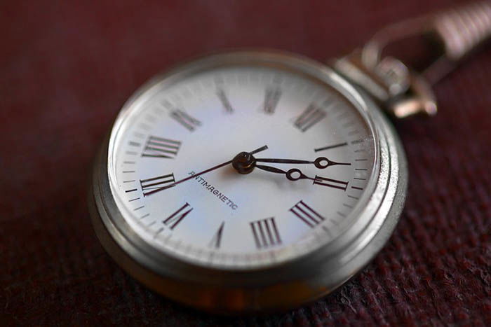 up close product photography of a wristwatch on an old style suitcase