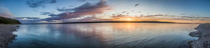 A stunning panoramic image of a seascape at evening time 