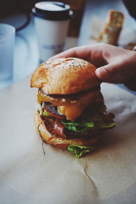 A huge burger styled for food photos