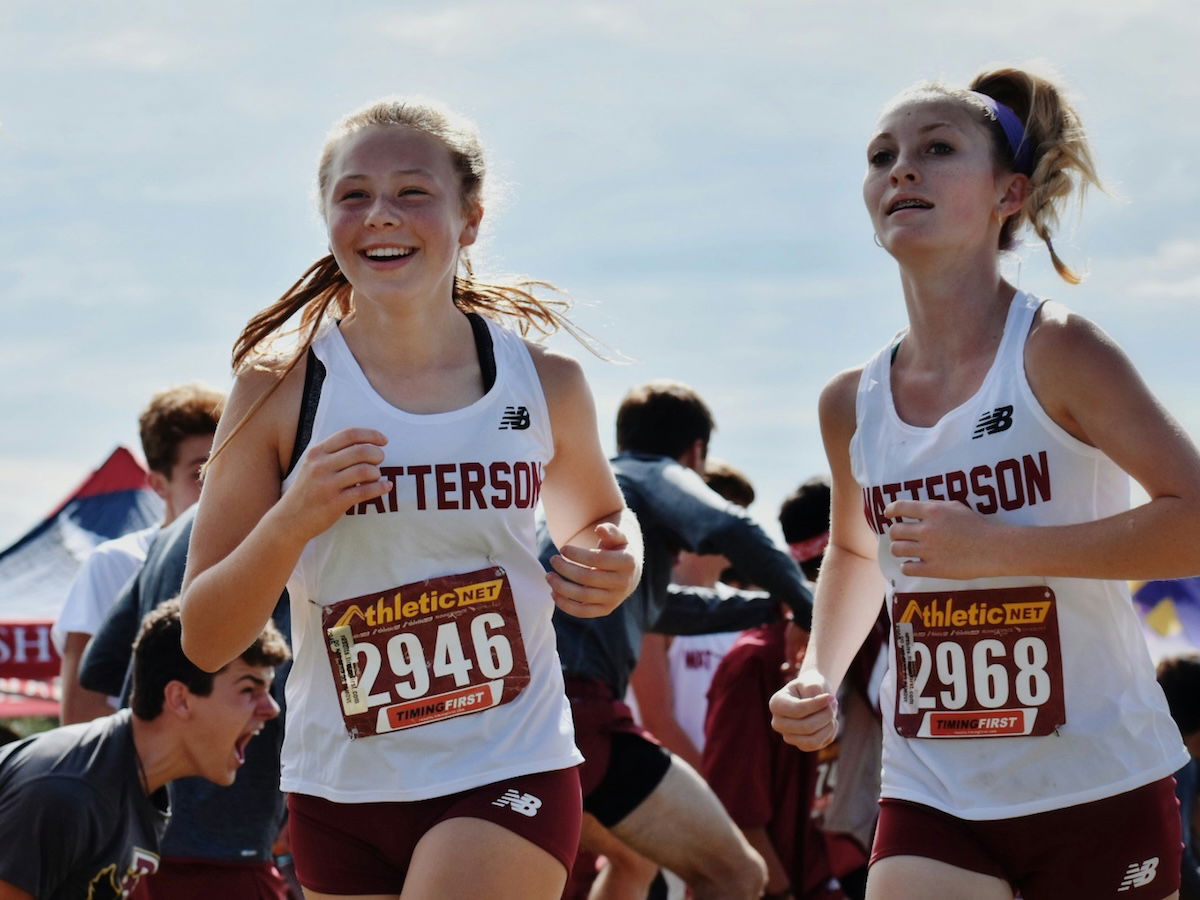 Medium shot of two young runners with bibs as an example of marathon photography