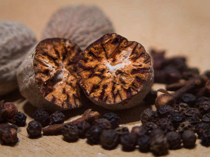 Rotten beetroot surrounded by pepper and other spices