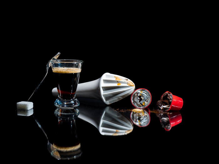 Commercial photo of coffee making equipment on black background