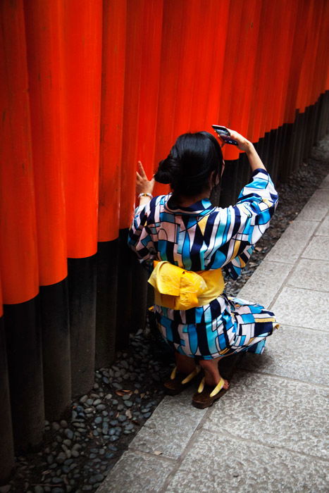 picture of a girl wearing a colorful kimono taking selfies