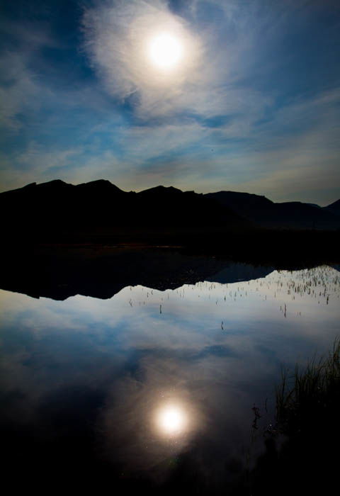 low key landscape photography of a lake and mountains in Gates of the Arctic National Park, Alaska. High and low key photography