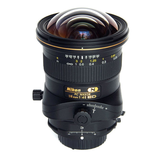 A Nikon Tilt-Shift lens on white background