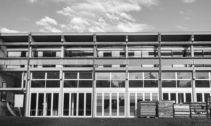 Black and white front view of the multilayered, multi windowed Student Union Building, University of Canterbury, New Zealand.