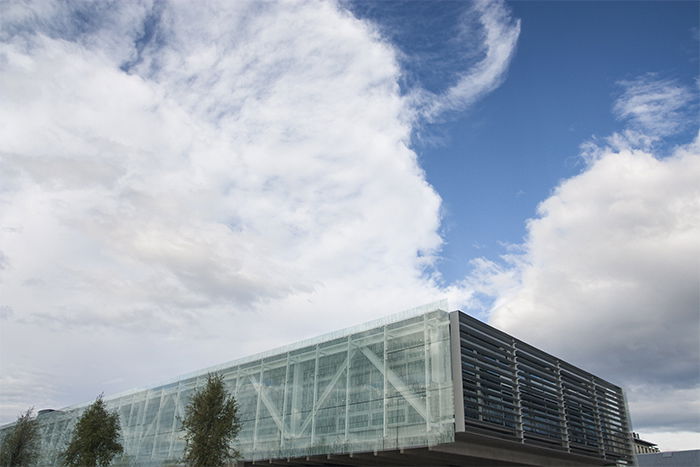 A photo of The rooftop of University of Canterbury ICT Building, New Zealand, most of the frame taken up by a cloudy blue sky