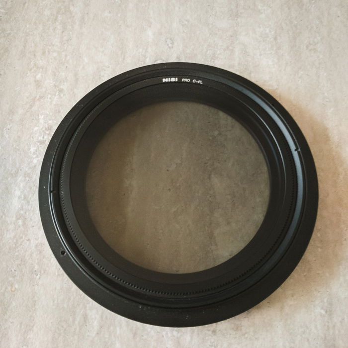 Close up image of a polariser filter or CPL for taking waterfall photos