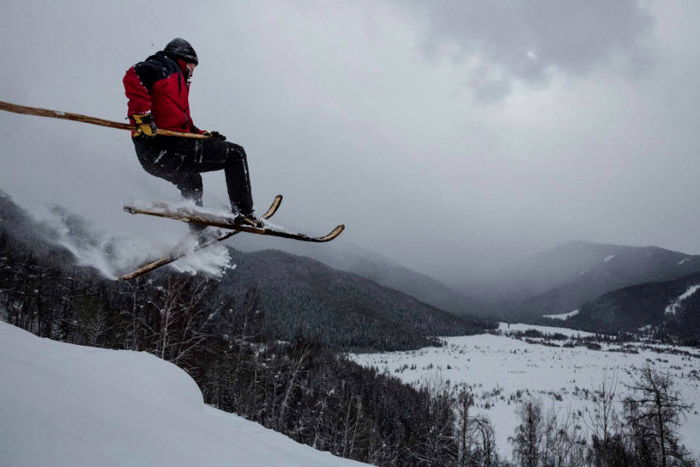 A photograph of a man skiing by Jonas Bendiksen.