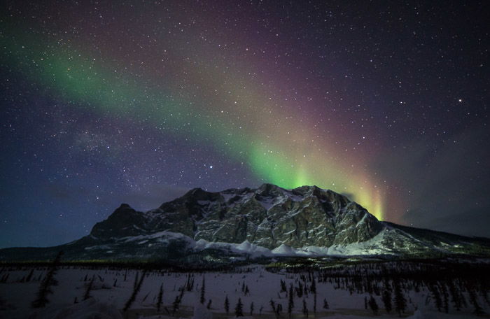 Multi colored Aurora Borealis lights over Sukakpak Mountain in northern Alaska.