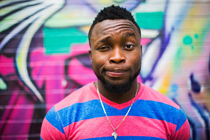 Portrait photography of a man in pink and blue striped jumper. Self portrait photography tips.