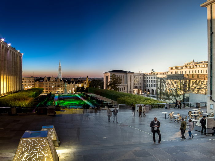 Combined images of Mons des Arts, Brussels (Belgium) with people passing by, taken from morning to night