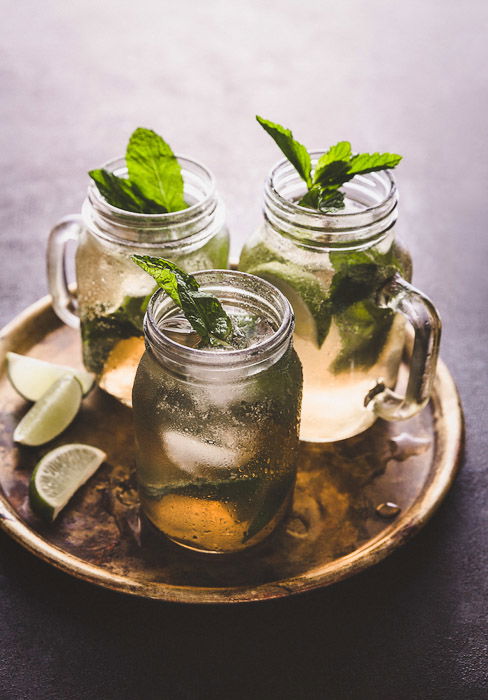 Food photography still life set up of a tray with three mojitos and lime wedges