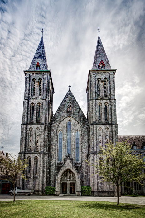 A photo of Maredsous Abbey on a clear overcast day