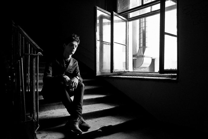 A natural light photography portrait of Sergey Sarkissian on the stairs in Saint Petersburg 