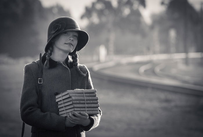 A black and white portrait shot of a young girl using natural light at the end of the day.