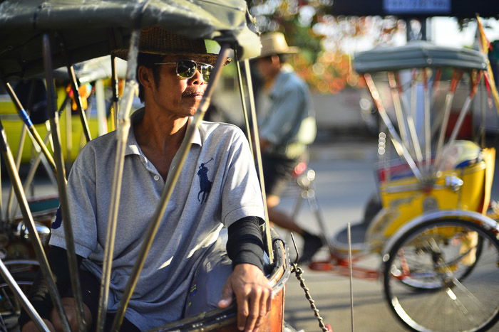 Tricycle taxi rider in Chiang Mai, Thailand.