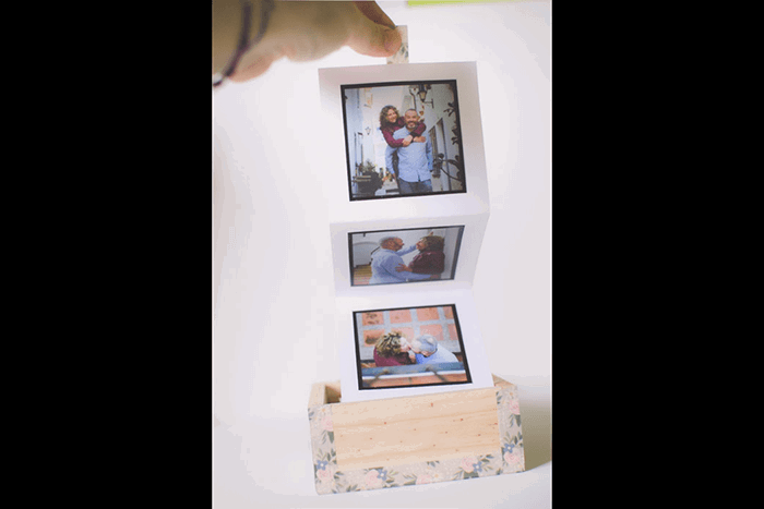 A photo accordion in a box as a unique idea for what to do with photos