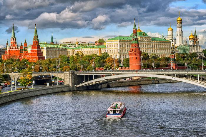 Beautiful city photography shot with a boat on a river in the foreground