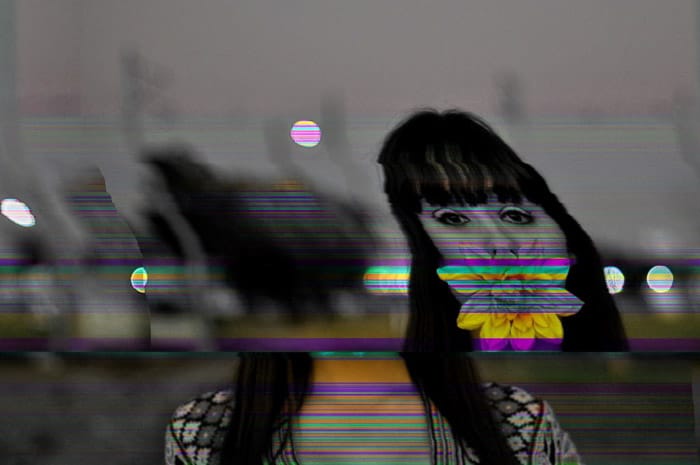 black and white portrait of a girl with colouful glitch art distorrtion - creating glitch effect on photoshop