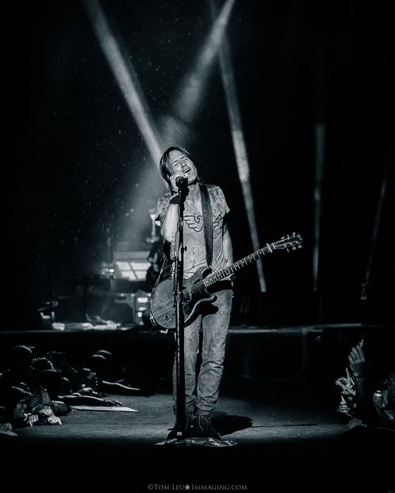 A black and white concert photography live shot of a Keith Urban onstage