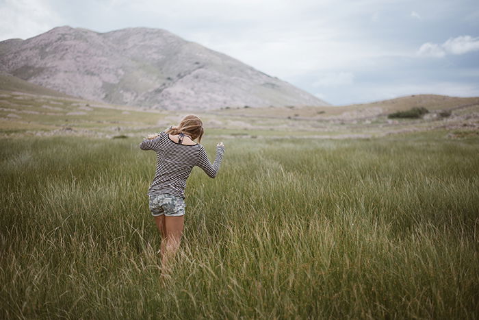 Portrait of a girl walk in front of a beautiful landscape 