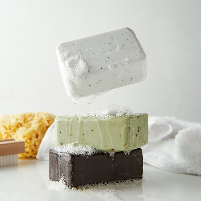 A product photography styling example of a stack of three soaps