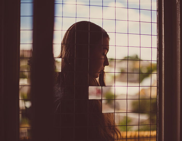 A cut-out puzzle portrait of a brown haired girl created in Photoshop