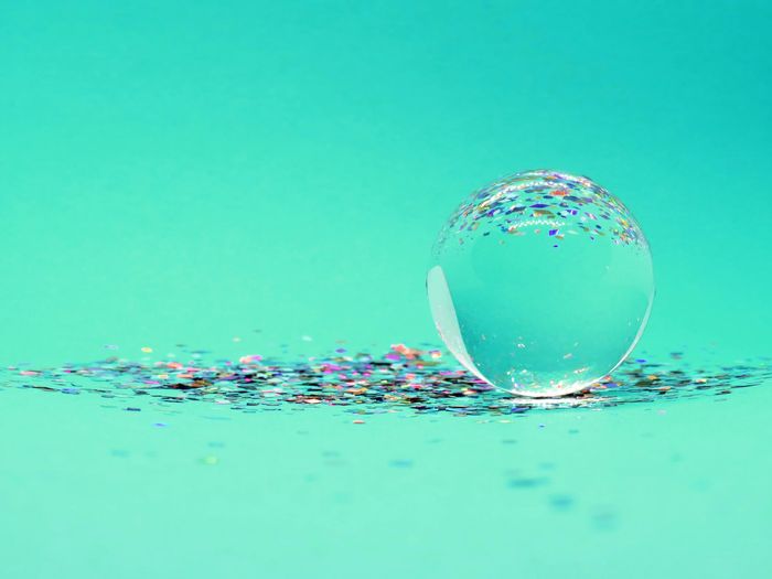 interesting photo of a soap bubble on green background