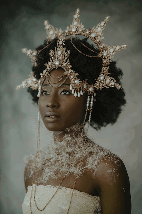 fine art portrait photography of a woman in a headdress and fancy dress